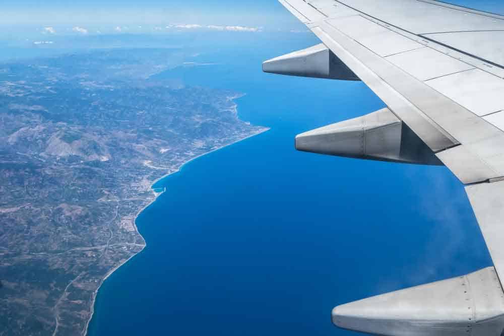 Airplane looking down at a city.