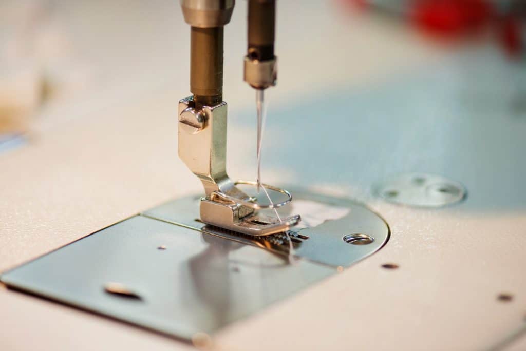 Close up of old sewing machine needle