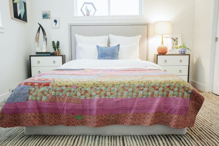 Double bed with patchwork quilt