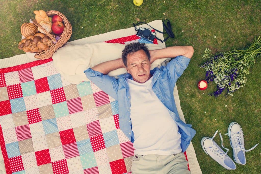 Senior man having a picnic