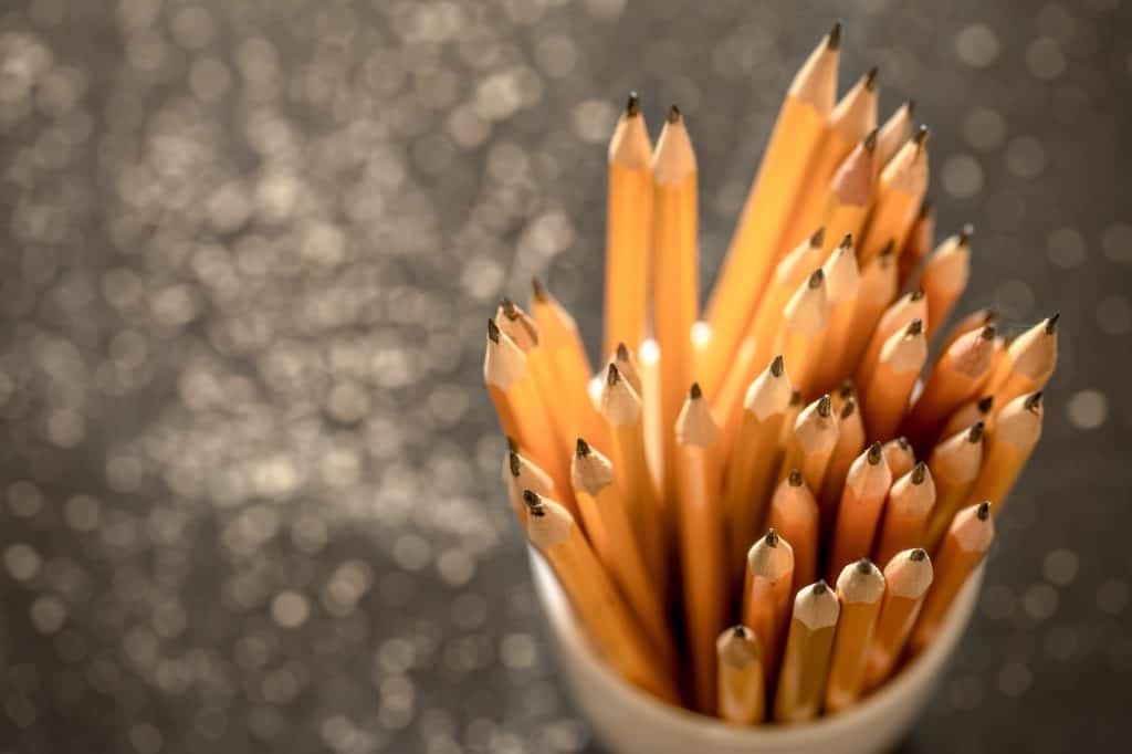 the stack of pencils in a glass